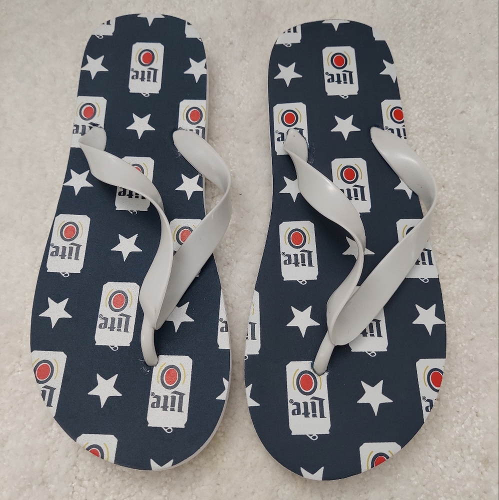 NWT. Lite Beer plastic Flip flops. Size 9/10.